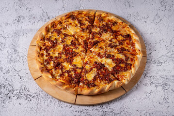 Pizza bolognese, pizza with minced meat. on a light concrete background