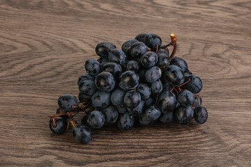 Purple grape branch over background