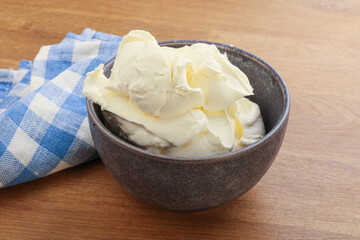 Italian soft mascarpone cheese in the bowl