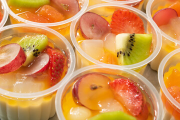 Cup filled with fresh fruits.