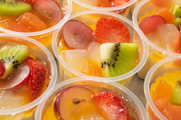 Cup filled with fresh fruits.