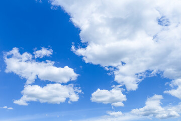 Naklejka na ściany i meble Big white cloud floating on blue sky, nature and season concept background