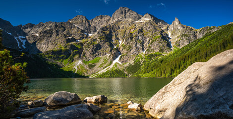 Panoramic view of Morskie oko or Eye of The Sea lake in Polish Tatra mountains at summer - obrazy, fototapety, plakaty