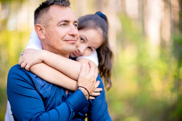 Fototapeta premium Little girl hugging her father.
