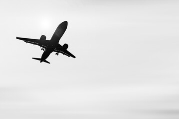 passenger plane silhouette Taking off from the airport. Passenger plane in the sky at sunrise or...