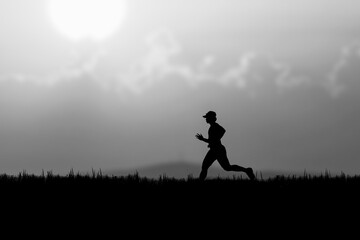 Fototapeta na wymiar Silhouette of a runner practicing in the evening. Training ideas after the coronavirus crisis