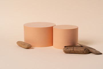 Geometric composition of aesthetic beige figures exposed on the beige background.