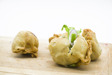 deep fried Singara made by potato and maida isolate on white background, spicy snacks