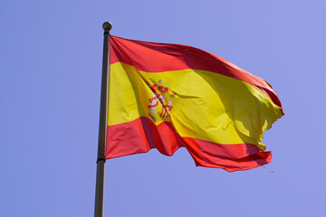 spain flag spanish float over blue sky in mat with wind