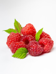 Ripe raspberries with leaf isolated on a white background