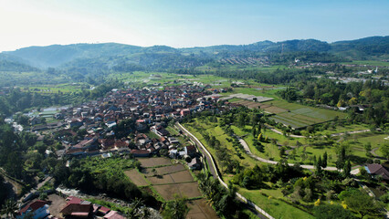 Fototapeta na wymiar Aerial view of The Taman Bunga Nusantara or Flower Garden Nusantara, a travel destination located in Cianjur. Cianjur, Indonesia, July 6, 2022