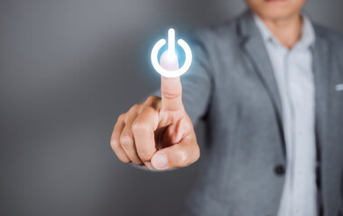 Businessman pressing power button. Start up business concept. copy space