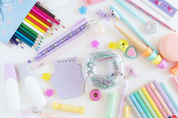 Flat lay composition with different colorful school stationery on white background. Back to school.
