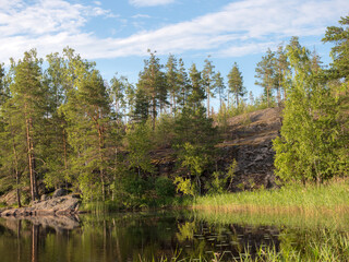 Fototapeta na wymiar rocks on a forest lake
