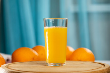 Freshly squeezed orange juice for health. Orange juice pouring pour oranges fruit fruits drink. Selective focus.