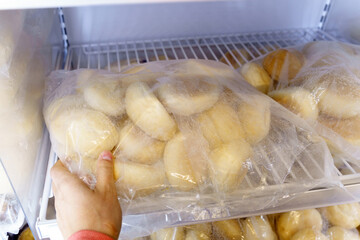 Frozen food on a shelf, big procurement and food storage in reserve. Frozen bread.