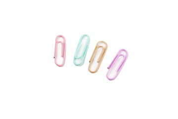 Multicolored paper clips close up isolated on white background. Stationery concept.
