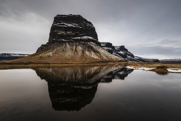 Lómagnúpur mountain (764 m) reflected in a small lake on Skeiðarársandur, right next to the Ring Road / Route 1, Southern Region, Iceland