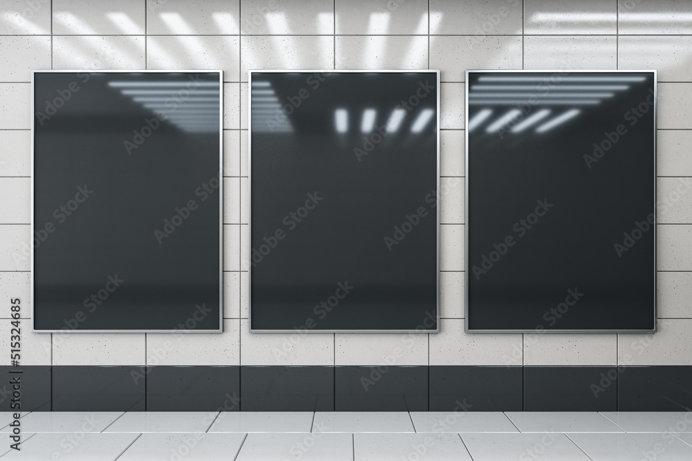 Aufkleber front view on three blank black advertising screens on light glossy ceramic tales wall with lamps re
