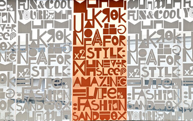 Closeup of The Letter stickers on stained glass wall abstract texture background at Thailand.