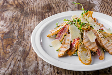 Caesar salad with ham, cheese, bacon