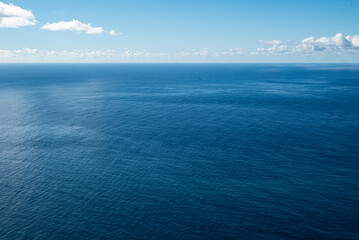 Clear and minimalistic panoramic seascape showing the endless blue waters of the Atlantic Ocean at...