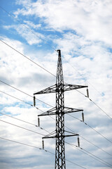 high-voltage power lines on blue sky background. electricity distribution station. Electrical net of poles on a panorama. power tower.