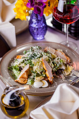 Salad with meat, boiled egg, cheese, salad, arugula