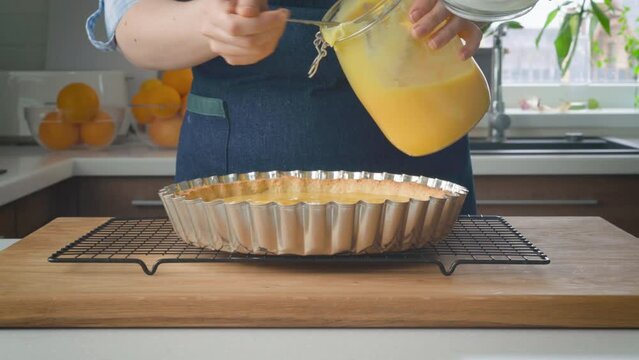 Woman cooking lemon tart