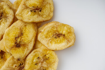 delicious dried banana on a white acrylic background