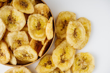 delicious dried banana on a white acrylic background