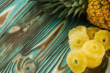 delicious dried pineapple on a wooden rustic background