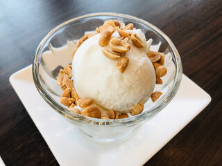 Coconut ice cream topped with roasted peanut in Thailand.