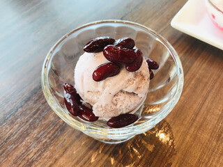Riceberry rice ice cream topped with sweetened red bean in Thailand.