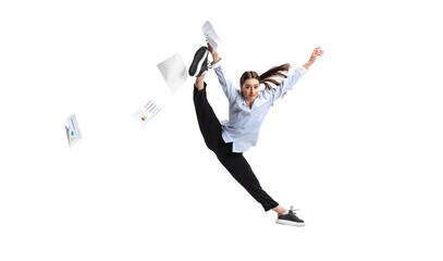 Portrait of female employee, office worker throwing papers in jump isolated over white background....