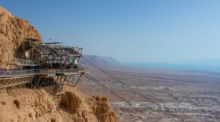 Foto op Plexiglas image of the Masada fortress against the backdrop of the Dead Sea © reznik_val