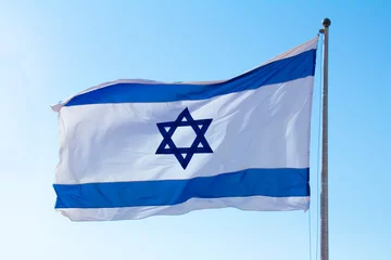 Foto op Plexiglas image of the flag of Israel On a bright sky background © reznik_val
