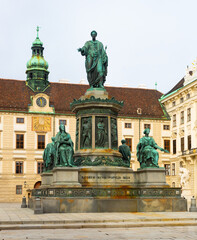 Obraz premium Bronze statue of the first Austrian Emperor Francis II, mounted on a multi-tiered pedestal with the signature in the city Vienna, Austria