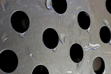 close-up metal plate texture background with water drops
