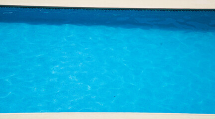 Fototapeta na wymiar top view of clear blue water in swimming pool