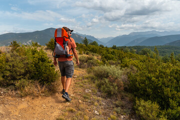 A man on a trek between the villages of Las Latas to Larrede near Sabiñanigo, Pyrenees aragon