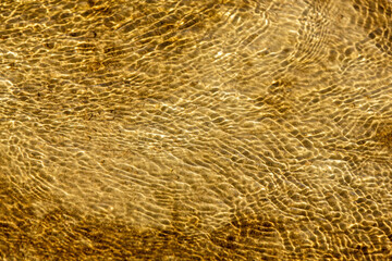 Water flows over a sand surface