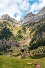 Fototapeta na wymiar A young woman enjoying the mountain on vacation in the Pyrenees, Alto Gallego, Huesca, Aragon