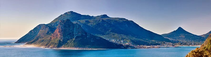 Fototapeten Panorama seascape, landscape, scenic view of mountains in Hout Bay in Cape Town, South Africa. Blue ocean and sea with hills. Travel and tourism abroad and overseas for a summer holiday and vacation © SteenoWac/peopleimages.com