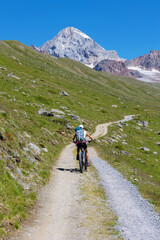 Fototapeta premium MTB excursion in the Valle dei Forni in Santa Caterina in Italy, on the bottom Mount Gran Zebrù