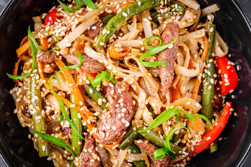 delicious chinese fried noodles on a black background