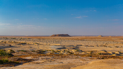 Isolated mountain in the middle of the desert in Morocco