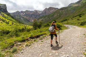 Fototapeta na wymiar A hiker on the trek in the Ripera valley in the town of Panticosa in the Pyrenees