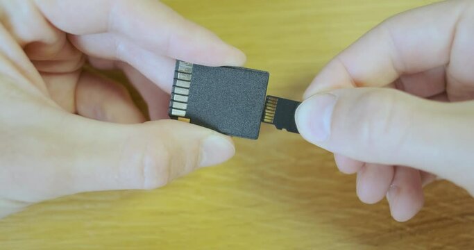 Micro sd card is inserted into the sd adapter, close-up.