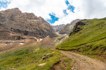 Path in the corner of the green near Salto de Tendenera in the Ripera valley, Pyrenees